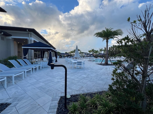 view of swimming pool featuring a gazebo and a patio area