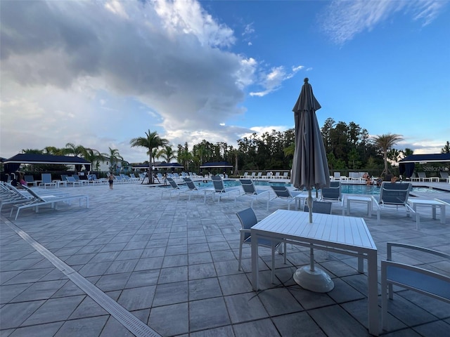 view of patio featuring a community pool