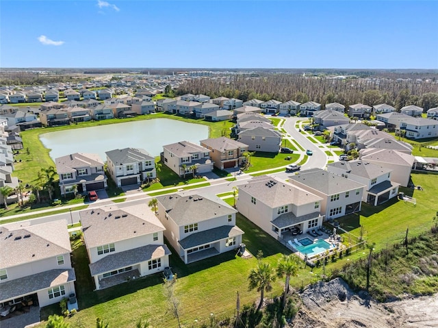 drone / aerial view with a water view