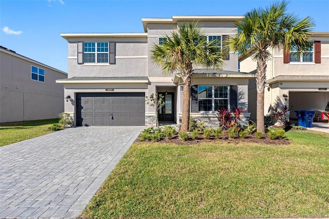 view of front of property with a garage and a front yard