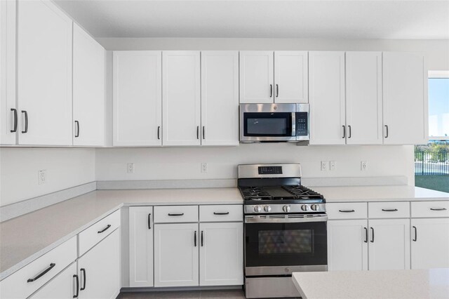 kitchen featuring white cabinets and stainless steel appliances