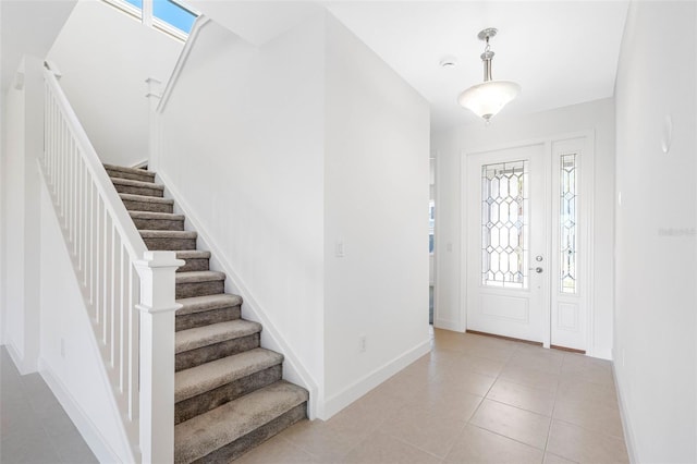 entrance foyer featuring light tile patterned flooring