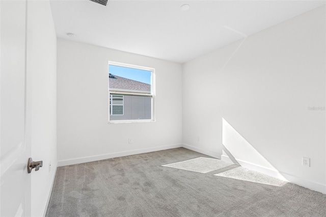 unfurnished room with light colored carpet