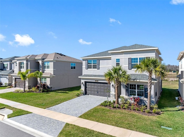 view of front of property featuring a garage and a front yard