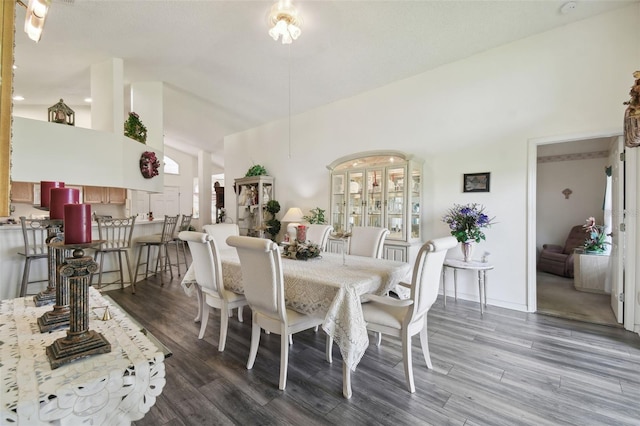 dining space with hardwood / wood-style floors