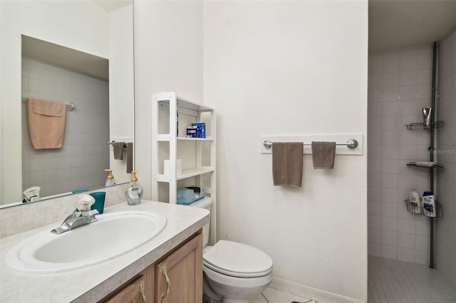 bathroom with vanity, toilet, and tile patterned floors