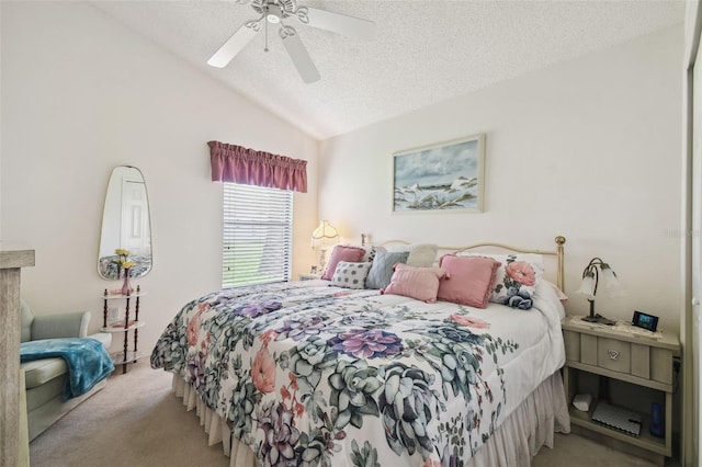 carpeted bedroom with lofted ceiling, a textured ceiling, and ceiling fan