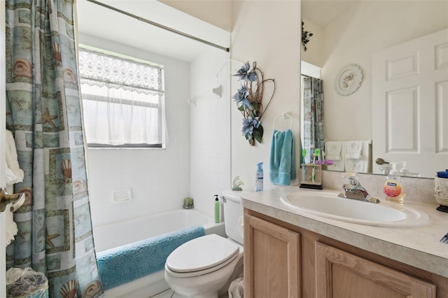 full bathroom featuring toilet, shower / bath combo with shower curtain, and vanity