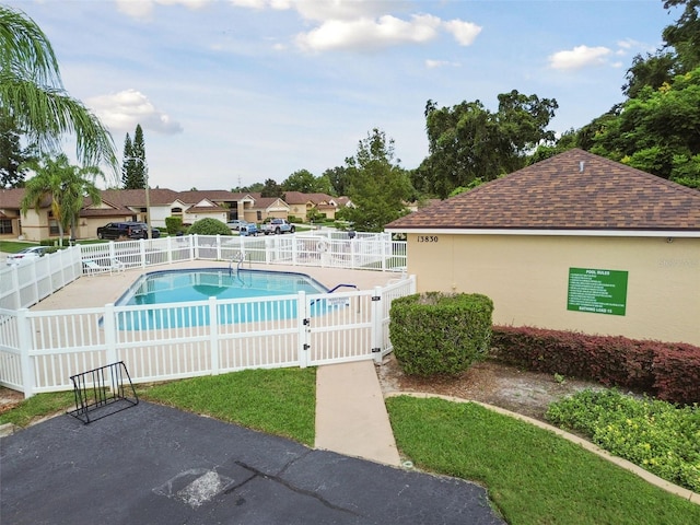 view of swimming pool with a patio