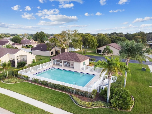 view of pool featuring a yard and a patio area