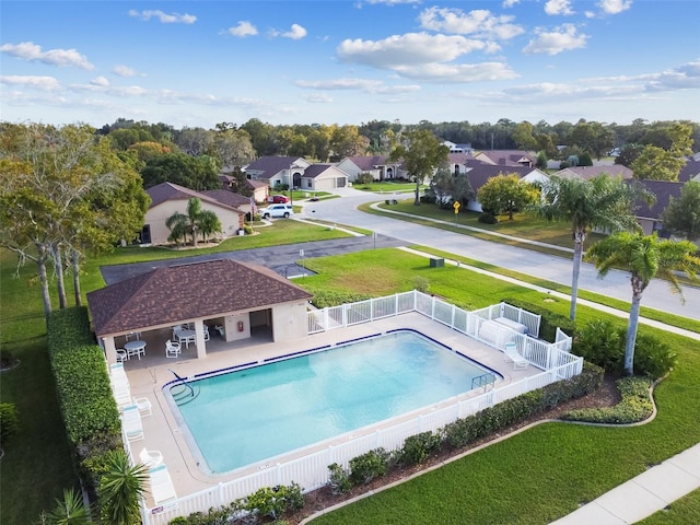 view of pool featuring a patio area and a lawn