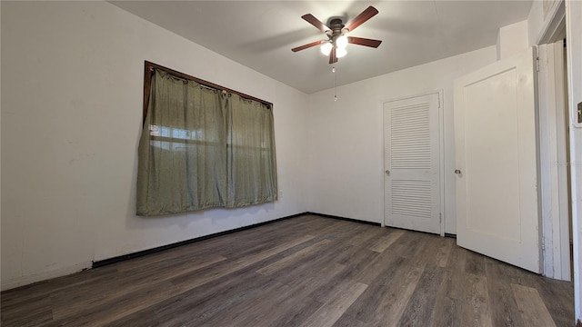 unfurnished bedroom with dark wood-style floors and ceiling fan