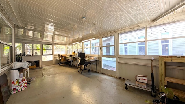 office with a sunroom and concrete floors