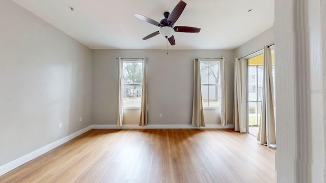 empty room with ceiling fan and light wood-type flooring