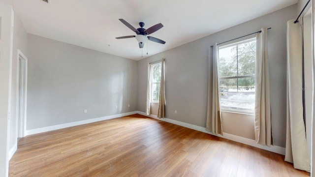 unfurnished room featuring light hardwood / wood-style flooring and ceiling fan