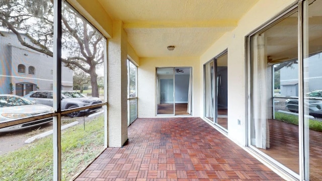 unfurnished sunroom with a wealth of natural light