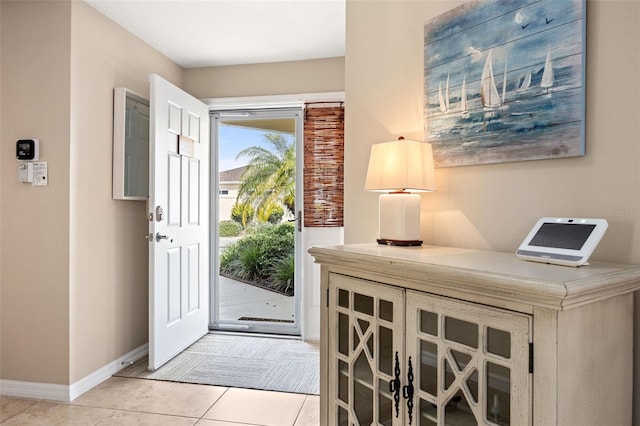 foyer featuring light tile patterned floors