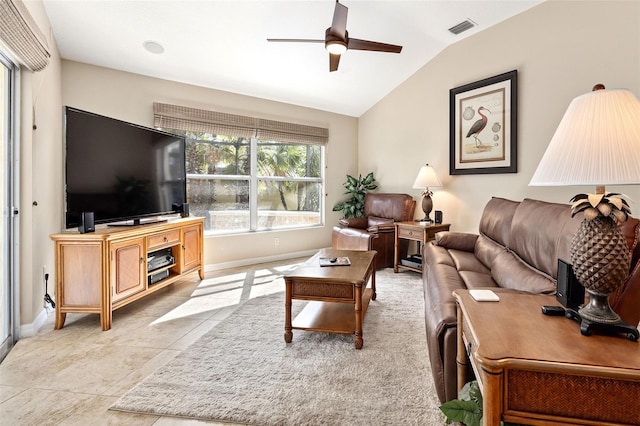 tiled living room with lofted ceiling and ceiling fan