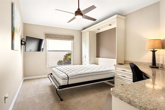 bedroom with ceiling fan and light colored carpet