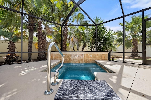 view of swimming pool featuring a patio area and a lanai