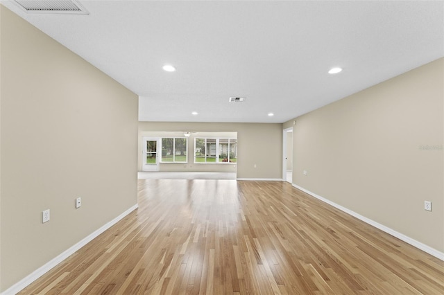 unfurnished living room featuring light hardwood / wood-style floors