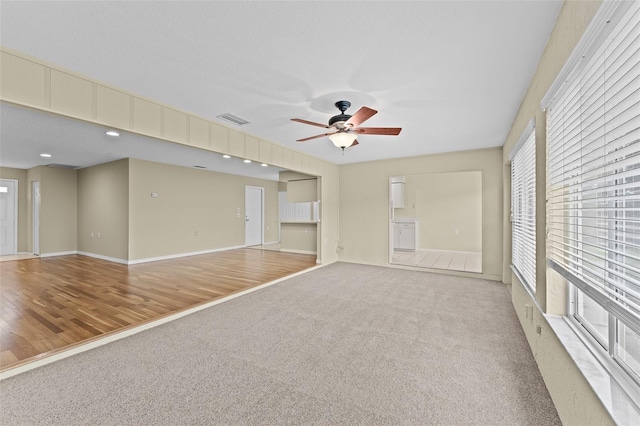 interior space featuring hardwood / wood-style flooring, plenty of natural light, and ceiling fan