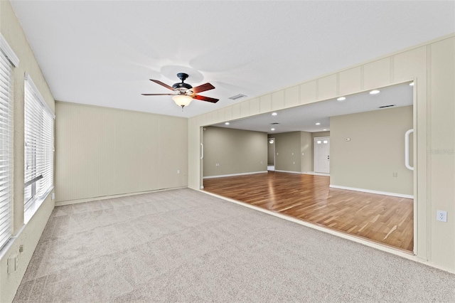 interior space with ceiling fan and light hardwood / wood-style flooring