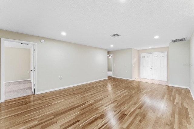 unfurnished room featuring light hardwood / wood-style floors