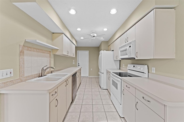 kitchen featuring sink, white cabinets, white appliances, and ceiling fan