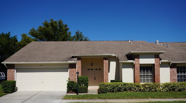 single story home with a garage