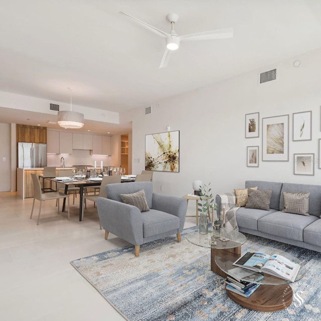 living room with sink and ceiling fan