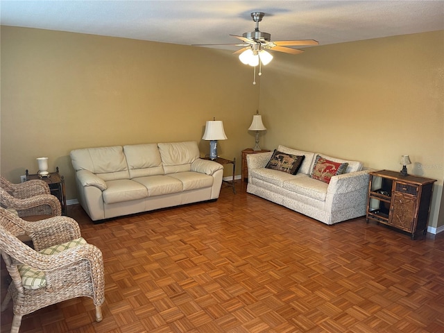 living room featuring parquet floors and ceiling fan