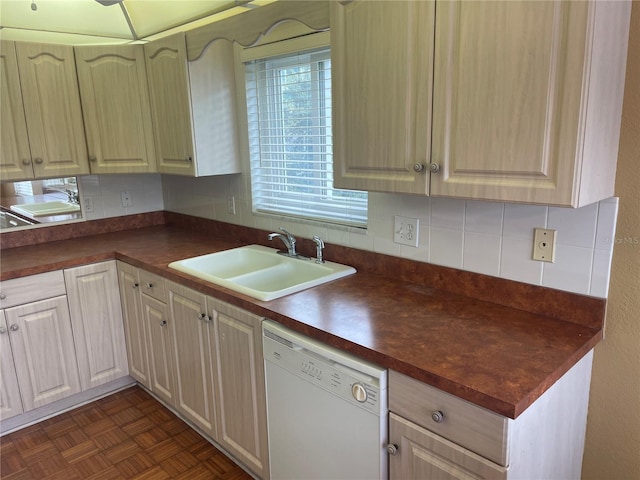 kitchen with butcher block counters, dark parquet flooring, white dishwasher, sink, and tasteful backsplash