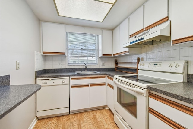 kitchen featuring light wood-type flooring, white appliances, white cabinetry, and sink