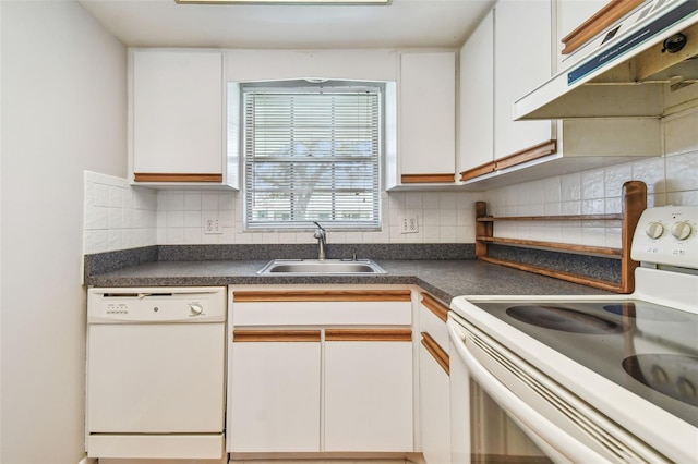 kitchen with white appliances, white cabinetry, and sink