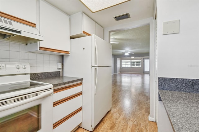 kitchen with decorative backsplash, white appliances, ventilation hood, white cabinets, and light hardwood / wood-style floors