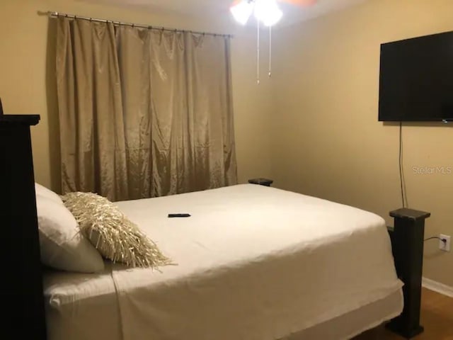 bedroom featuring hardwood / wood-style flooring