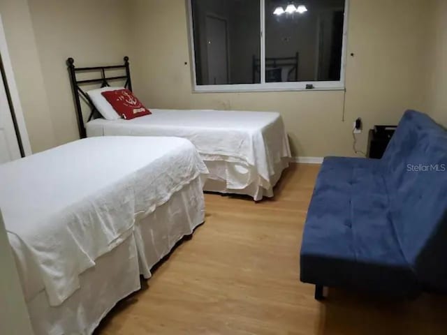 bedroom with light hardwood / wood-style flooring