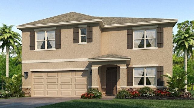 view of front of house with a front yard and a garage