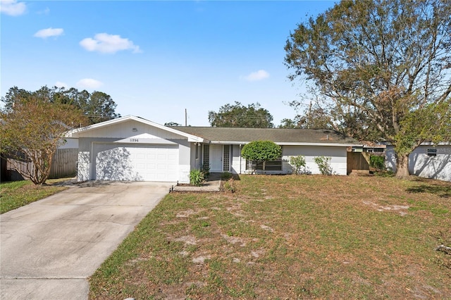 ranch-style home with a front yard and a garage