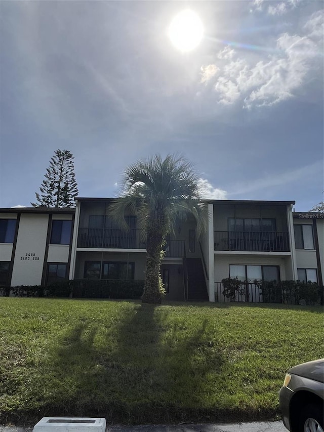 2688 Pine Ridge Way N Unit D1, Palm Harbor, FL 34684 - view of building exterior with stairs