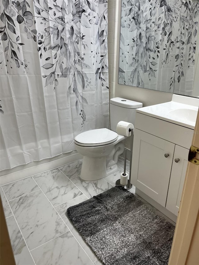 bathroom featuring vanity and toilet