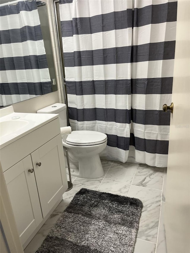 2688 Pine Ridge Way N Unit D1, Palm Harbor, FL 34684 - full bath with marble look tile flooring, toilet, and vanity