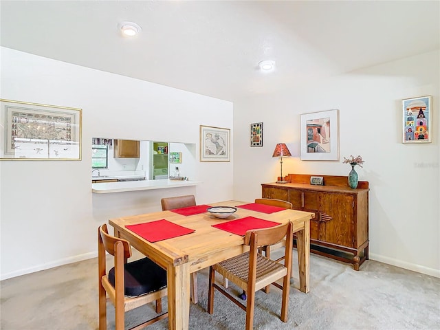 view of carpeted dining space