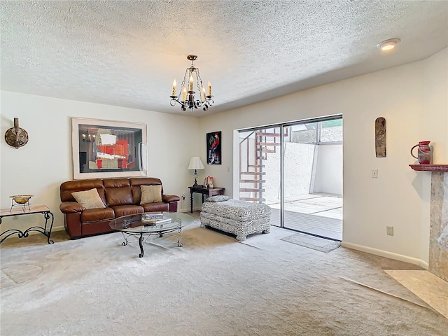 living room featuring a notable chandelier, carpet, and a textured ceiling