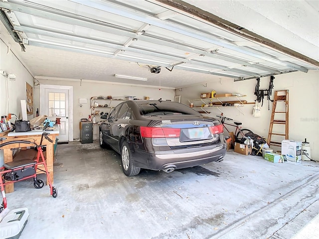 garage featuring a garage door opener