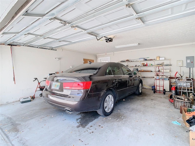 garage featuring a garage door opener