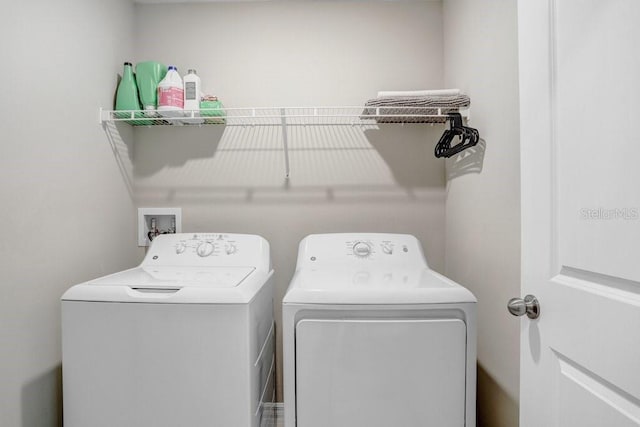 laundry room featuring separate washer and dryer