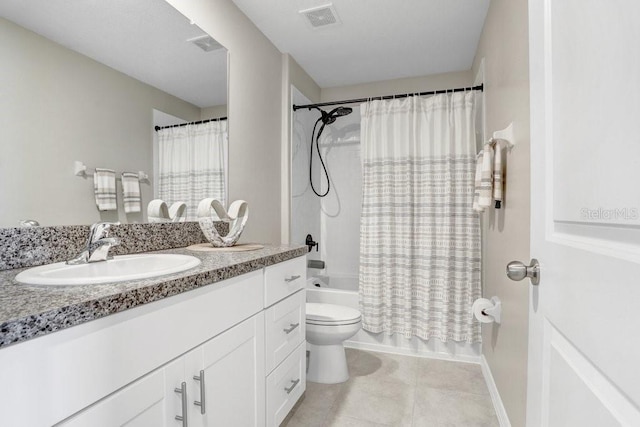 full bathroom featuring vanity, shower / tub combo with curtain, toilet, and tile patterned flooring