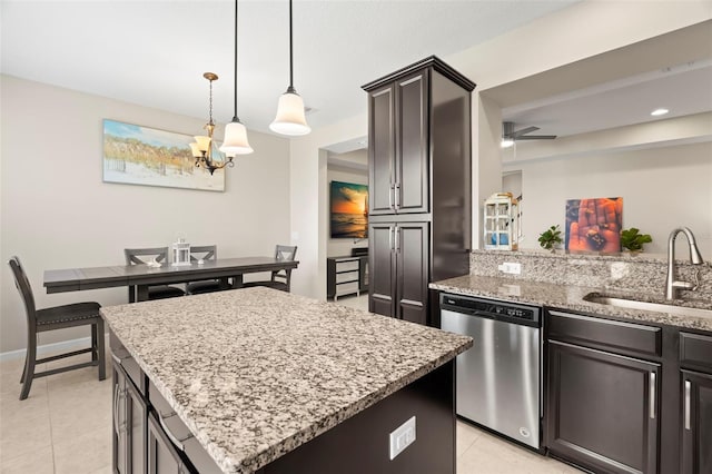 kitchen featuring decorative light fixtures, dishwasher, sink, a center island, and dark brown cabinetry